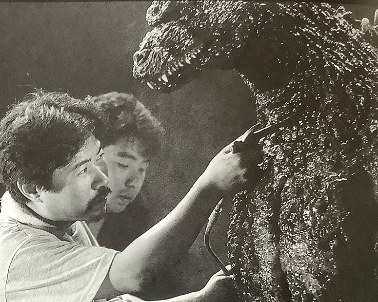 Yuji Sakai giving air to suit actor Kenpachiro Satsuma during filming of Godzilla vs Destoroyah